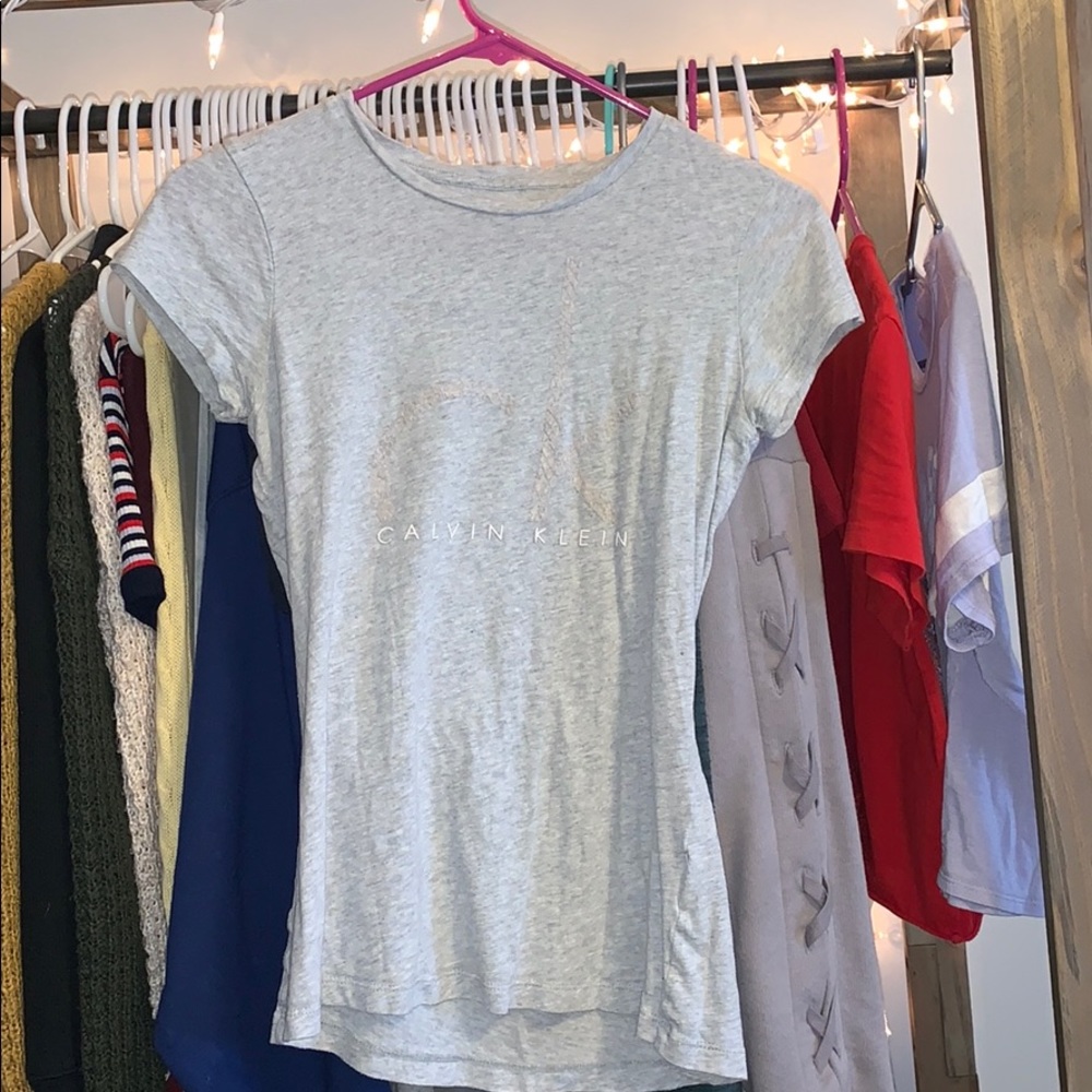 light gray Calvin Klein T-shirt.